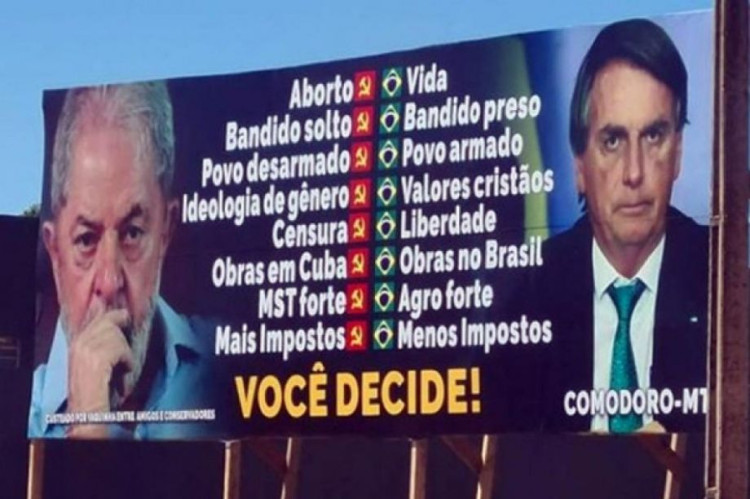 Justiça dá 24h para retirada de outdoor que associa Lula a bandido e aborto em Comodoro